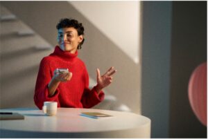Woman smiling listening to her cell phone
