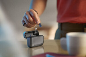 Person holding ReSound Vivia hearing aid